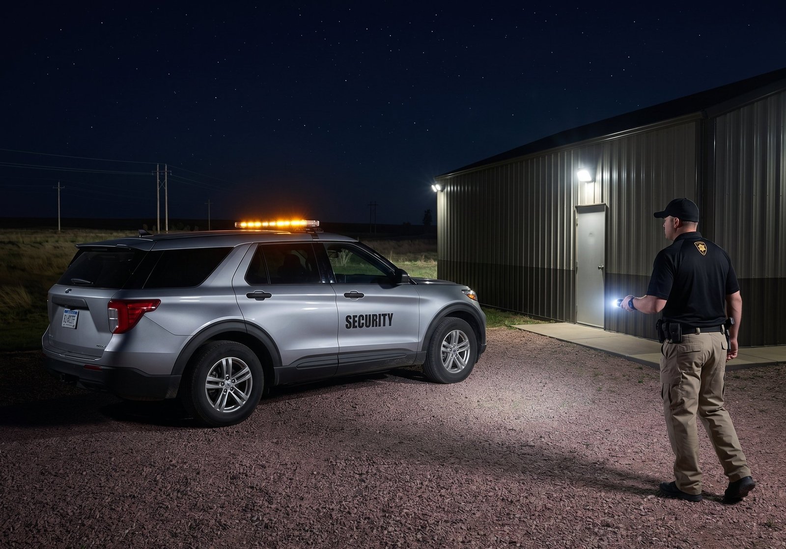 Overnight security officer conducting a flashlight check at a remote outdoor site